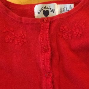 Hartstrings red sweater cute details.Christmas